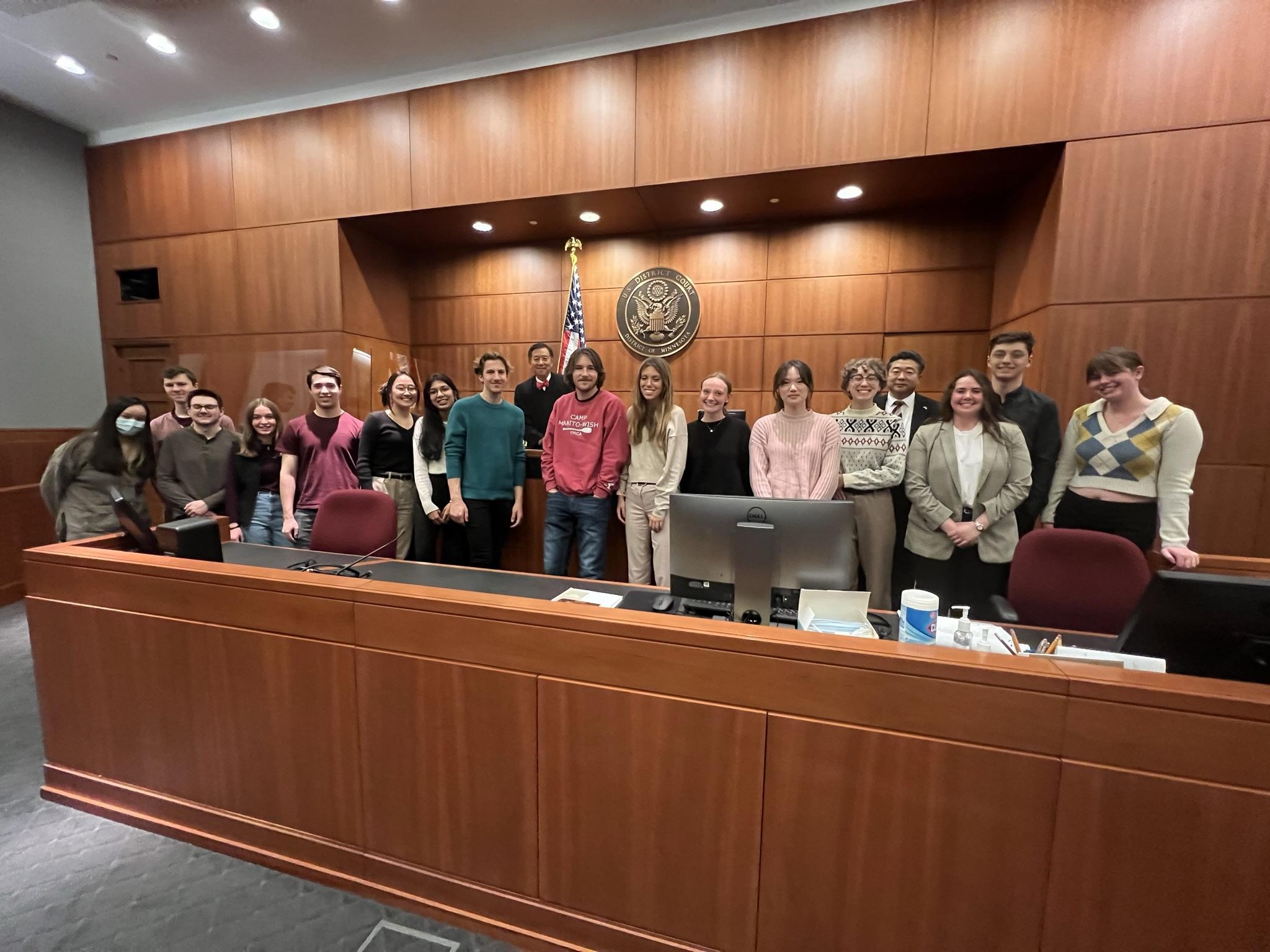 Students standing in a courtroom