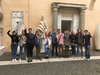 Students pose in front of the Colossus of Constantine Marble Hand in the courtyard of Palazzo dei Conservatori in Rome Students pose in front of the Colossus of Constantine Marble Hand in the courtyard of Palazzo dei Conservatori in Rome