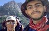 Marcus Zachary and Dom Marticorena hiking in the mountains.